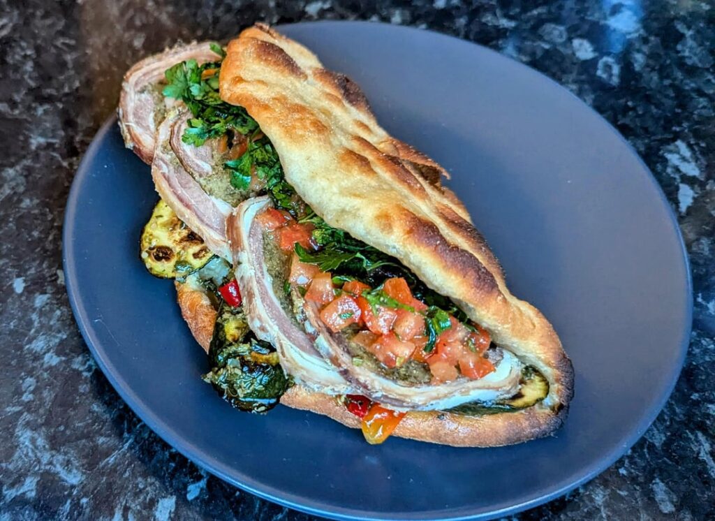 Stuffed lamb breast, marinated courgettes and tomato