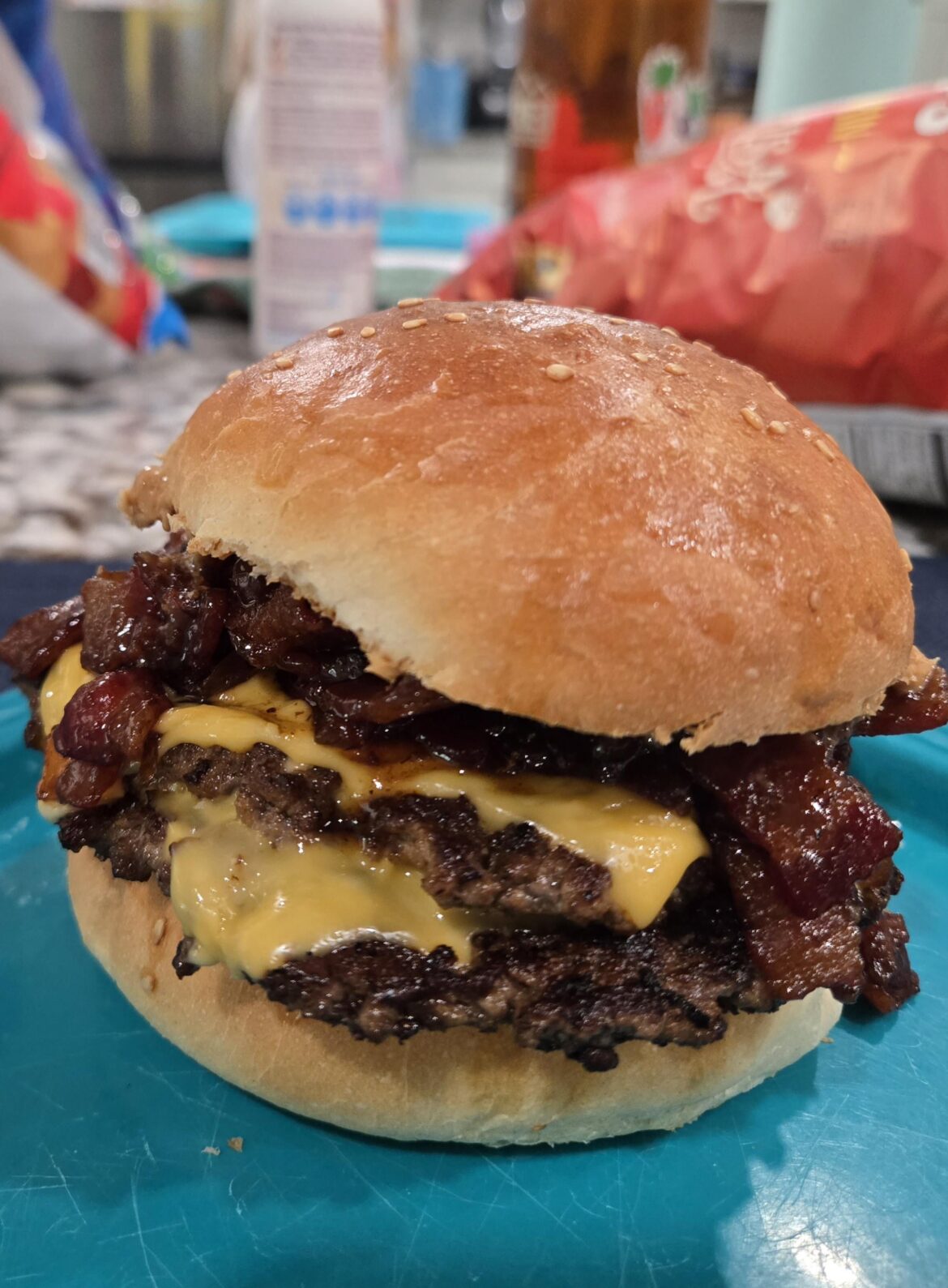 Peanut butter double smash burger with cheese and bacon strawberry jam on homemade sourdough buns