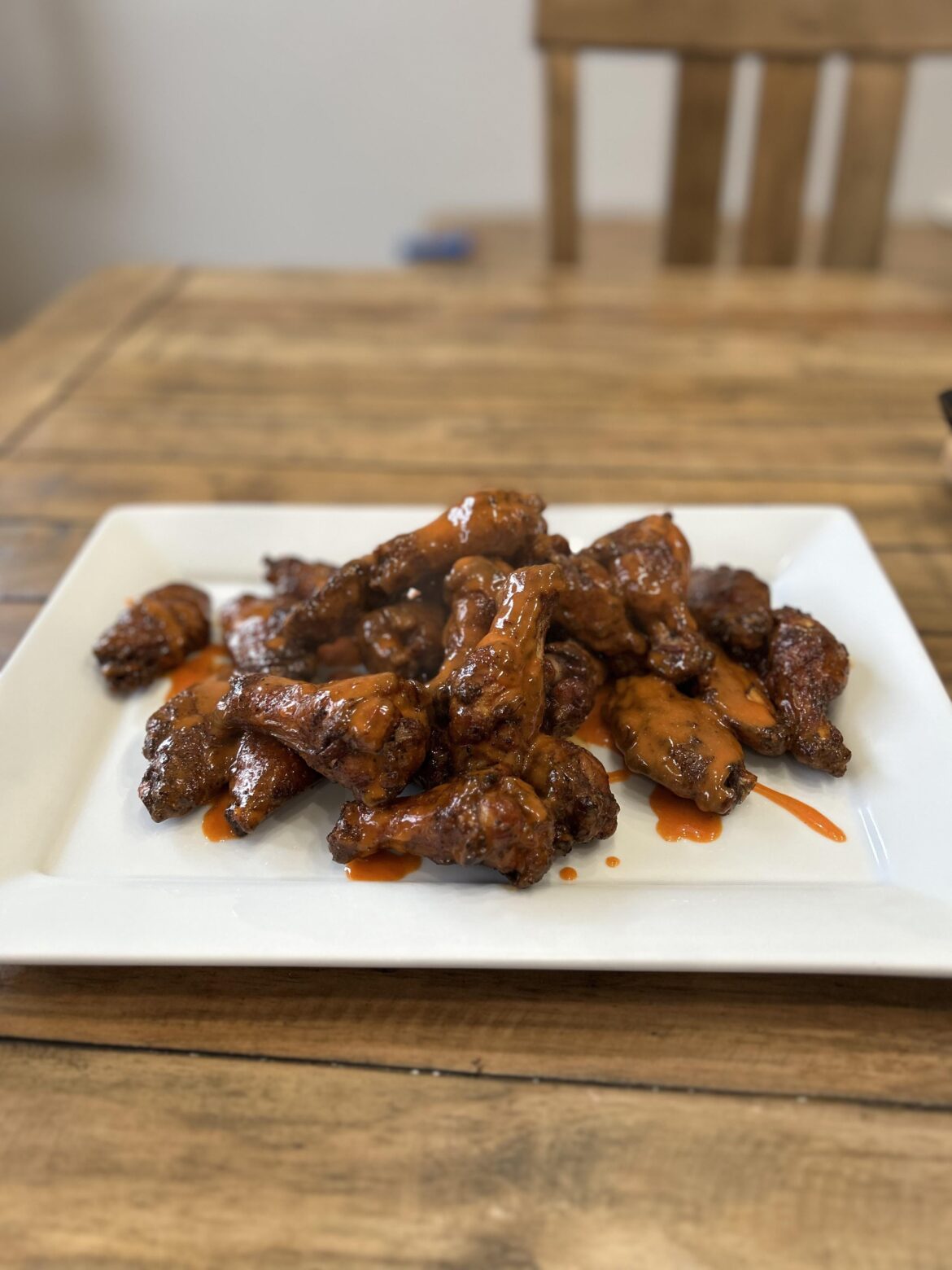 Nailed the wings tonight on the Joetisserie. 400F for 30 minutes covered then 10 minutes uncovered for crispiness. Tossed in a chunk of applewood for some smokiness.