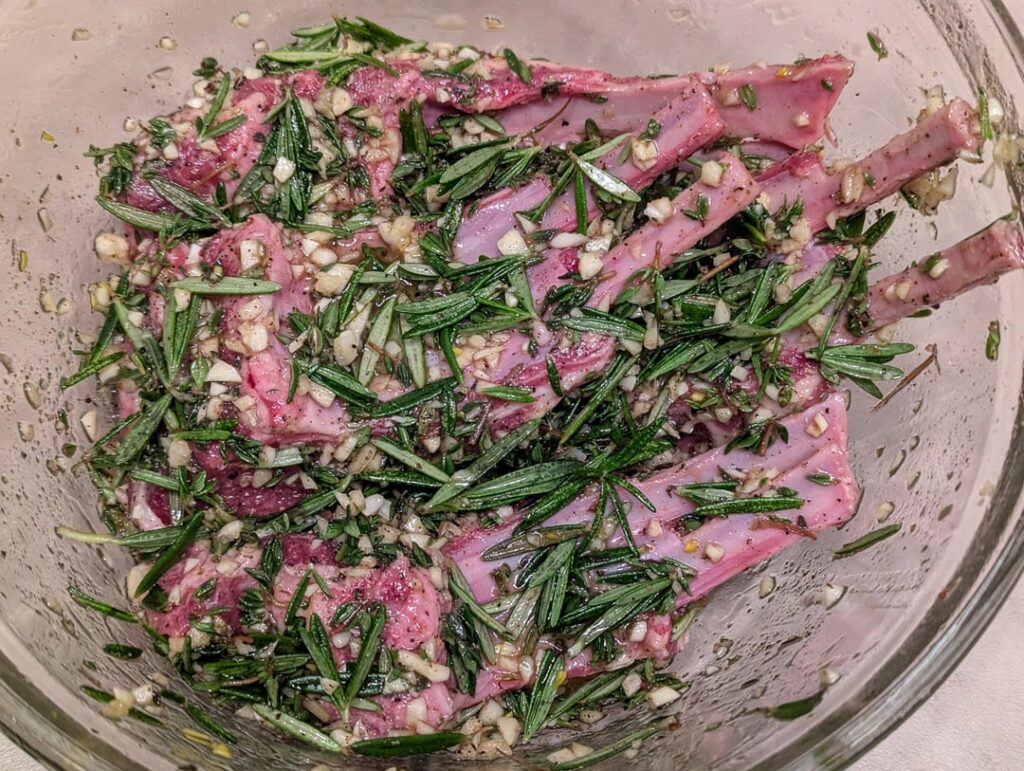 Prepared fresh rosemary garlic thyme lamb chops for overnight marinating