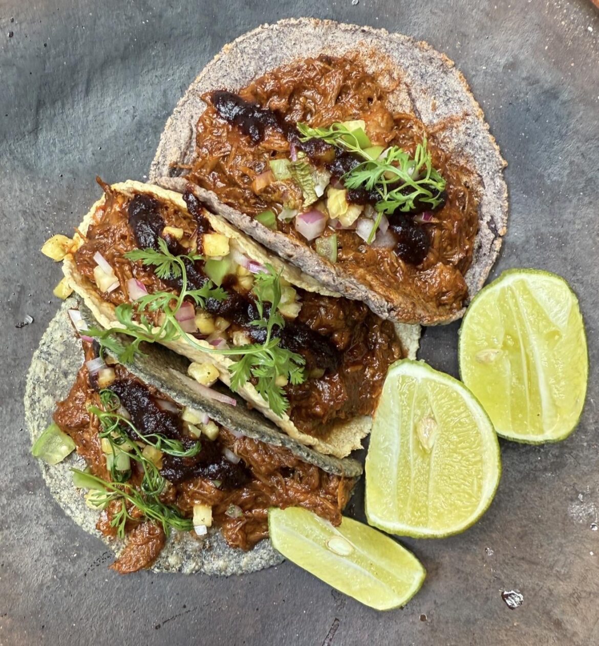Barbacoa de pato (duck) on fresh nixtamal corn tortillas at Maizajo in Mexico City