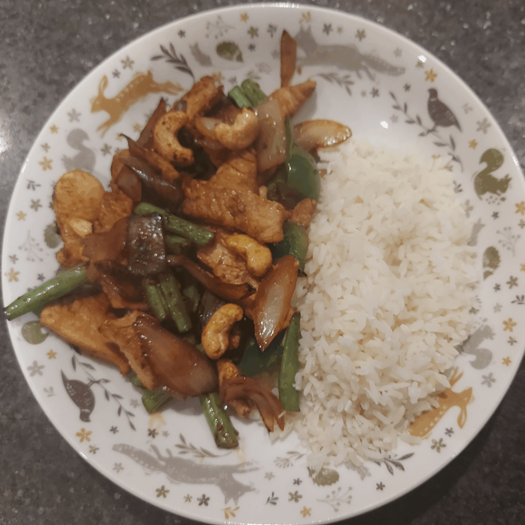 Teriyaki turkey with veggies and rice.