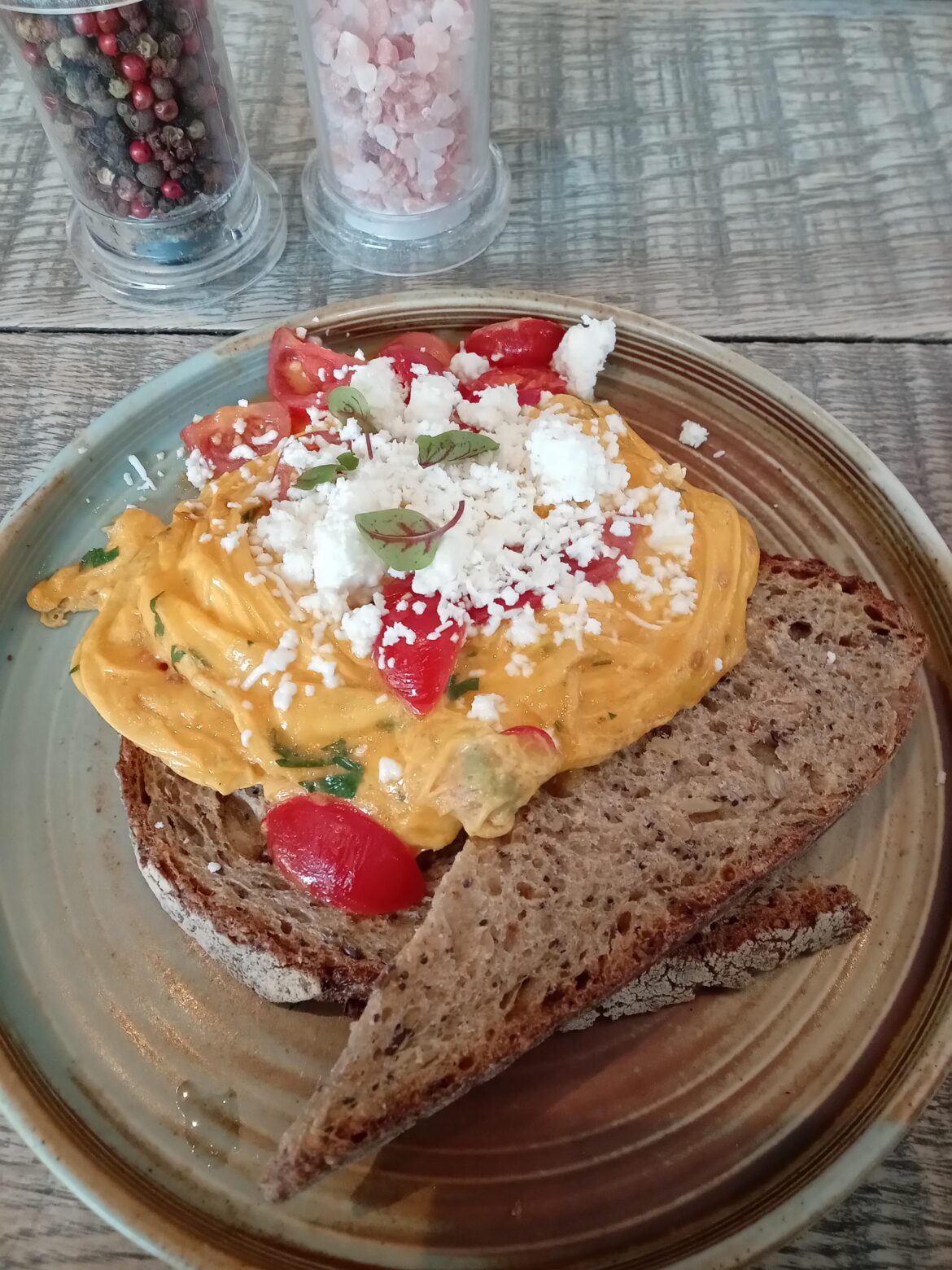 Eggs, tomato, chilli, and feta