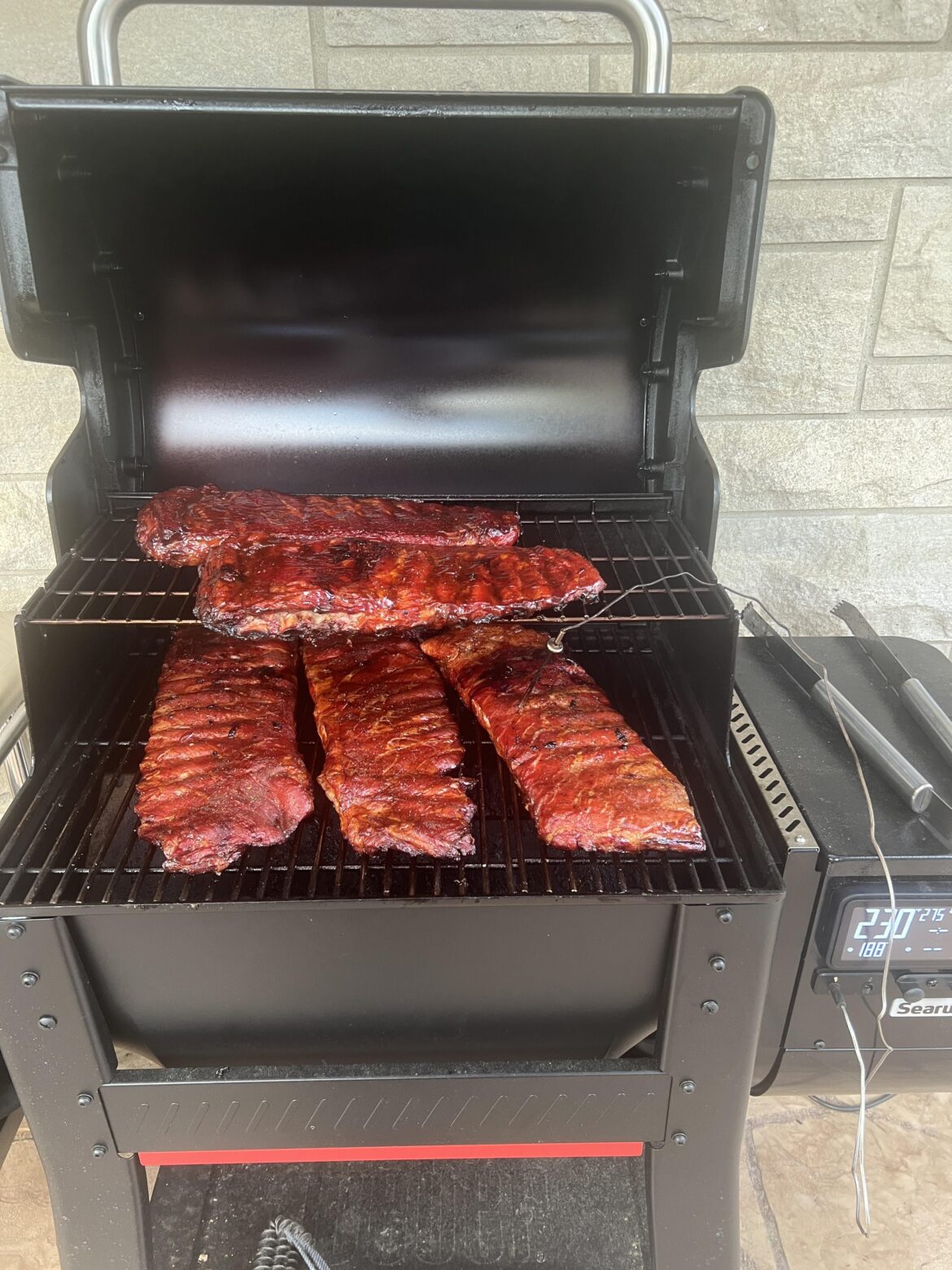 Searwood 600 can hold 5 racks of St. Louis ribs flat. Maybe 6.