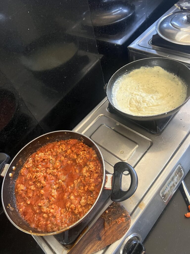 Made lasagna with chicken ragu and bechamel sauce, mozzarella and cheddar cheese