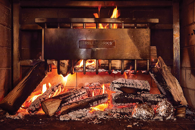 The kitchen's fired-up grill at Hearthside.