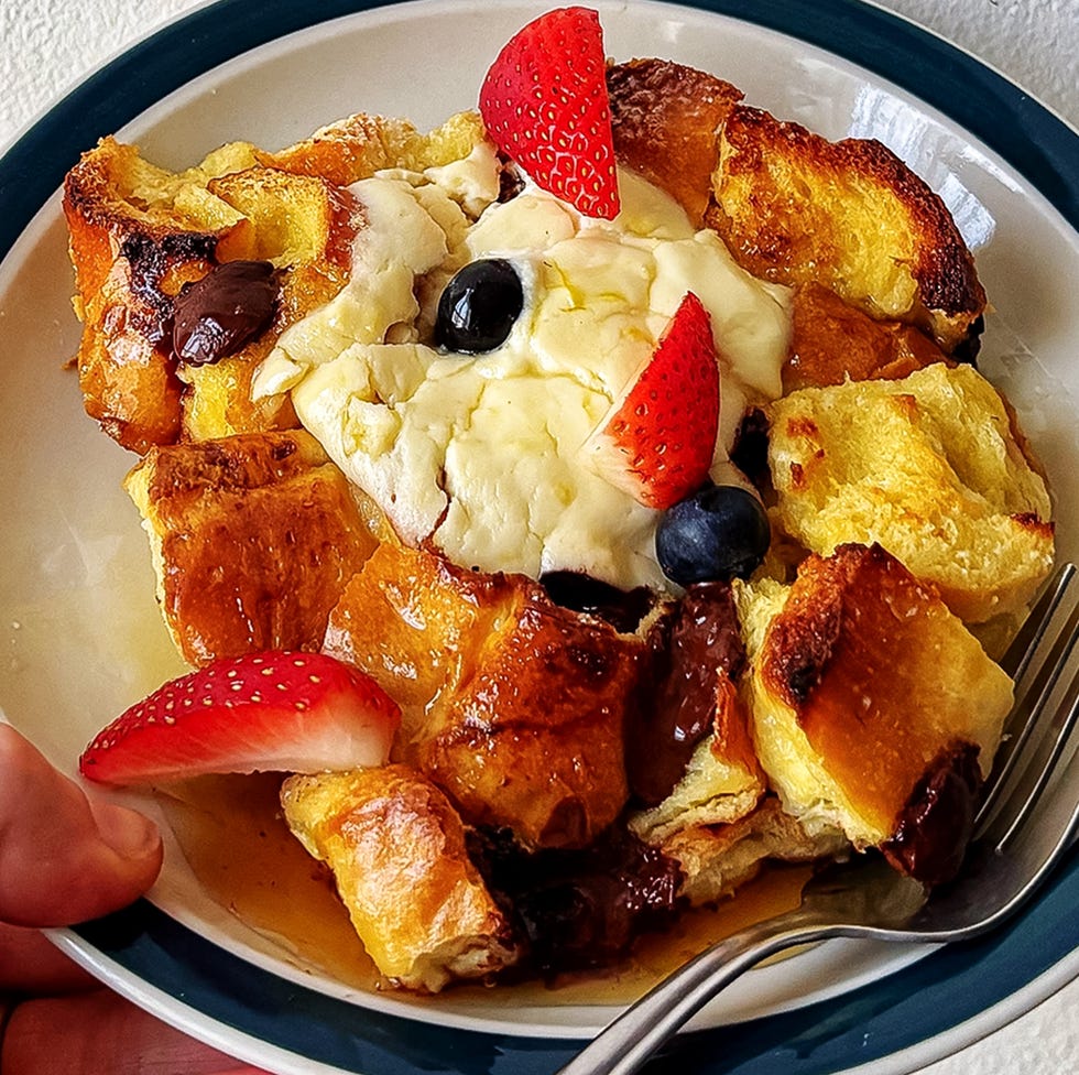sheet pan french toast topped with ricotta, chocolate chips, and fresh berries