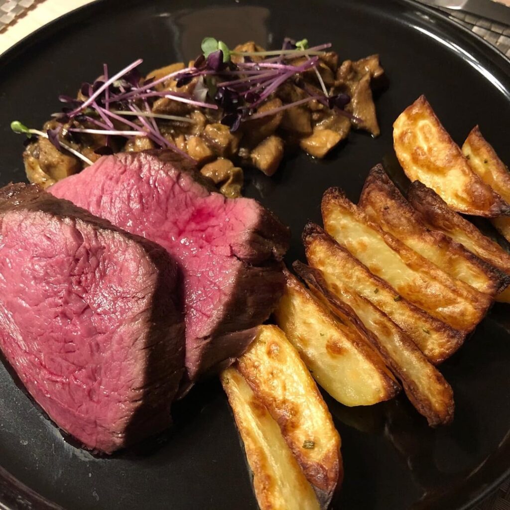 Chateaubriand, 53 degree Celsius for 5h. This dish is from my record some time ago. With Ofen baked potatos, wild mushrooms, self picked and some decorative Sprouds.