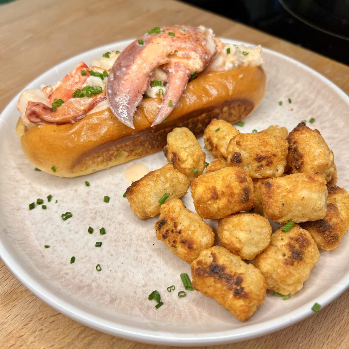 Lobster Roll with Old Bay Tots