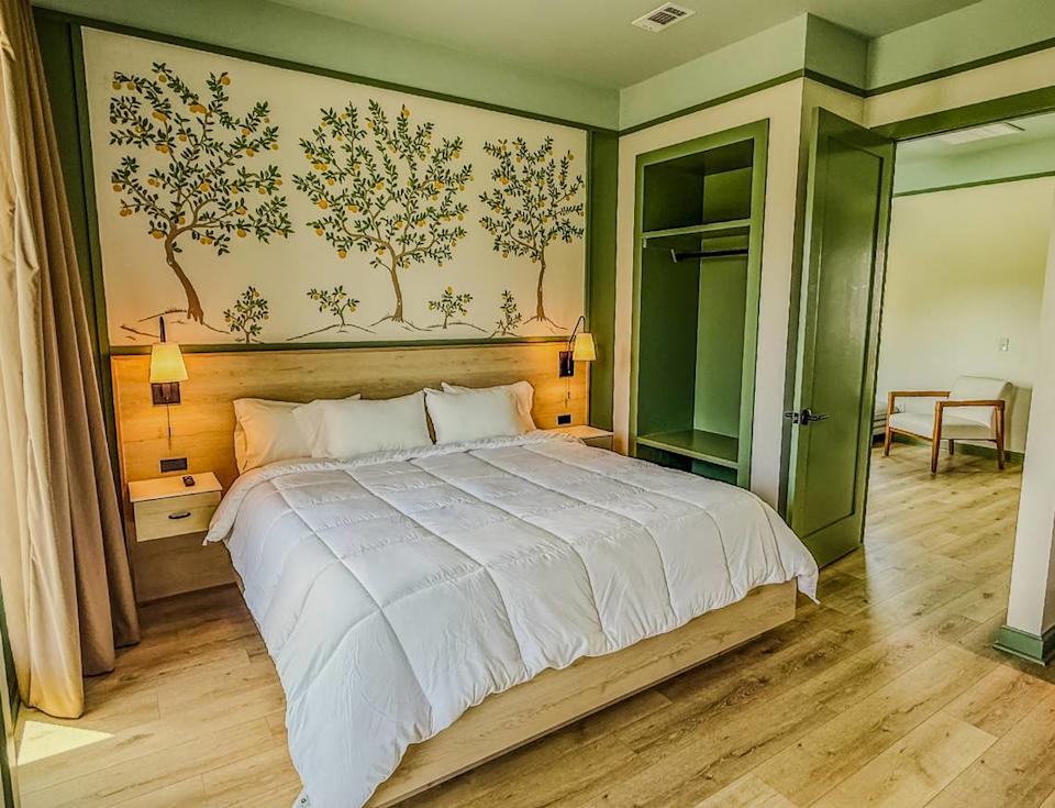A king bedroom at the new Pass Bungalows in Pass Christian features handmade furniture, balconies or terraces with views of the great lawn or the harbor.