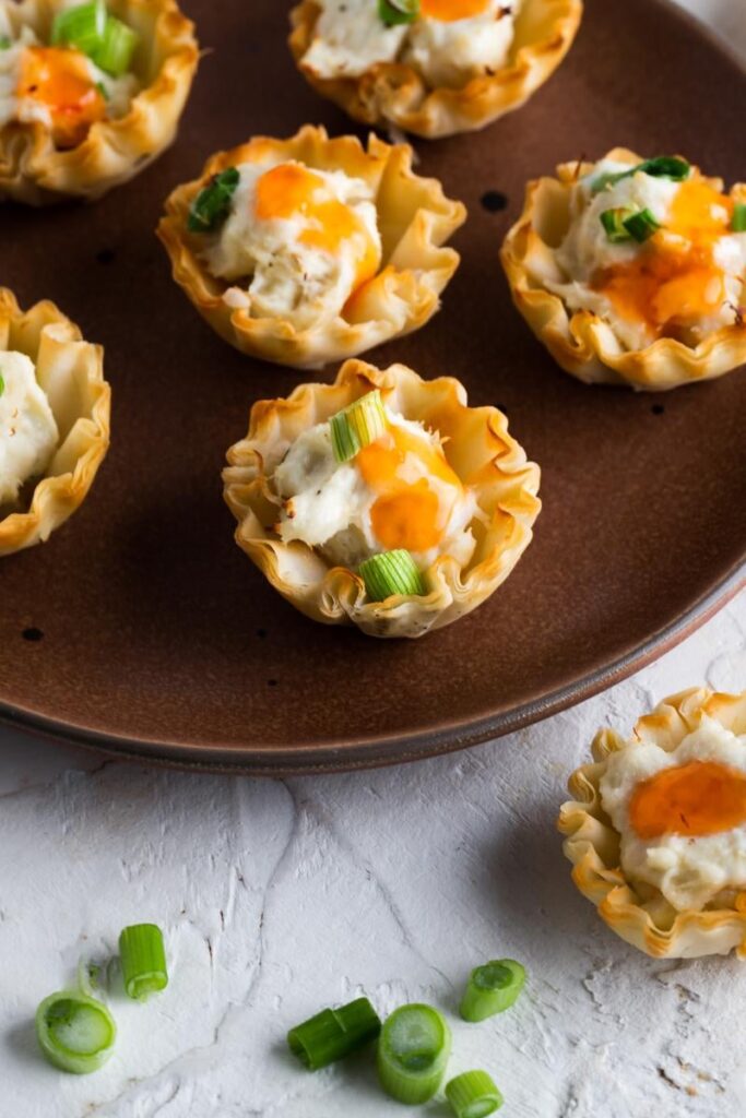 [OC] Crab Rangoon Cups.  I love crab rangoon but wanted a more simple deconstructed version that had the same flavors but didn't take a lot of time or effort to make.  I decided to use phyllo dough cups and add the crab rangoon mixture.