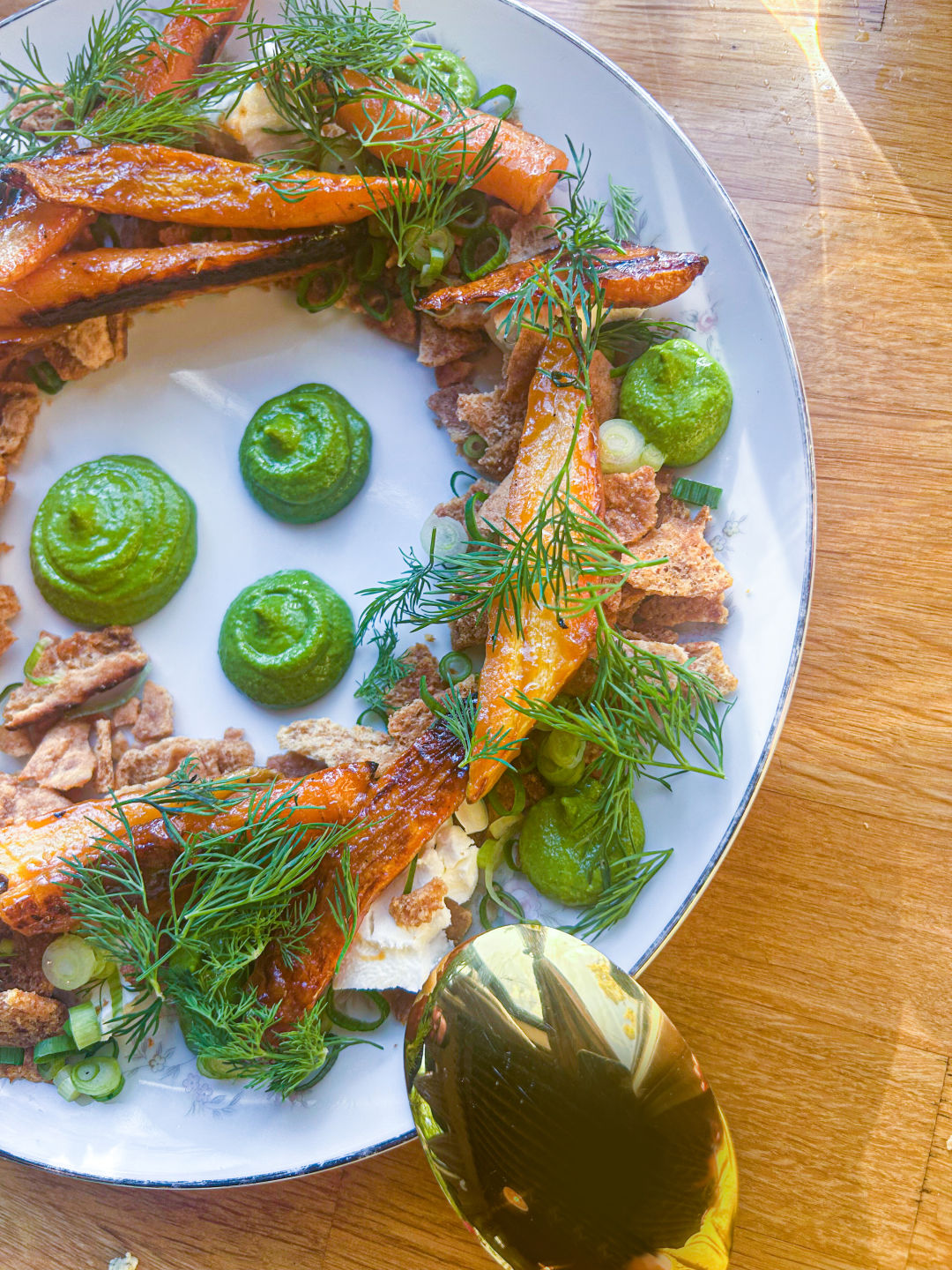 A dish at Bar Nouveau with carrots, chevre, a green herb sauce, and whole wheat pita shards.