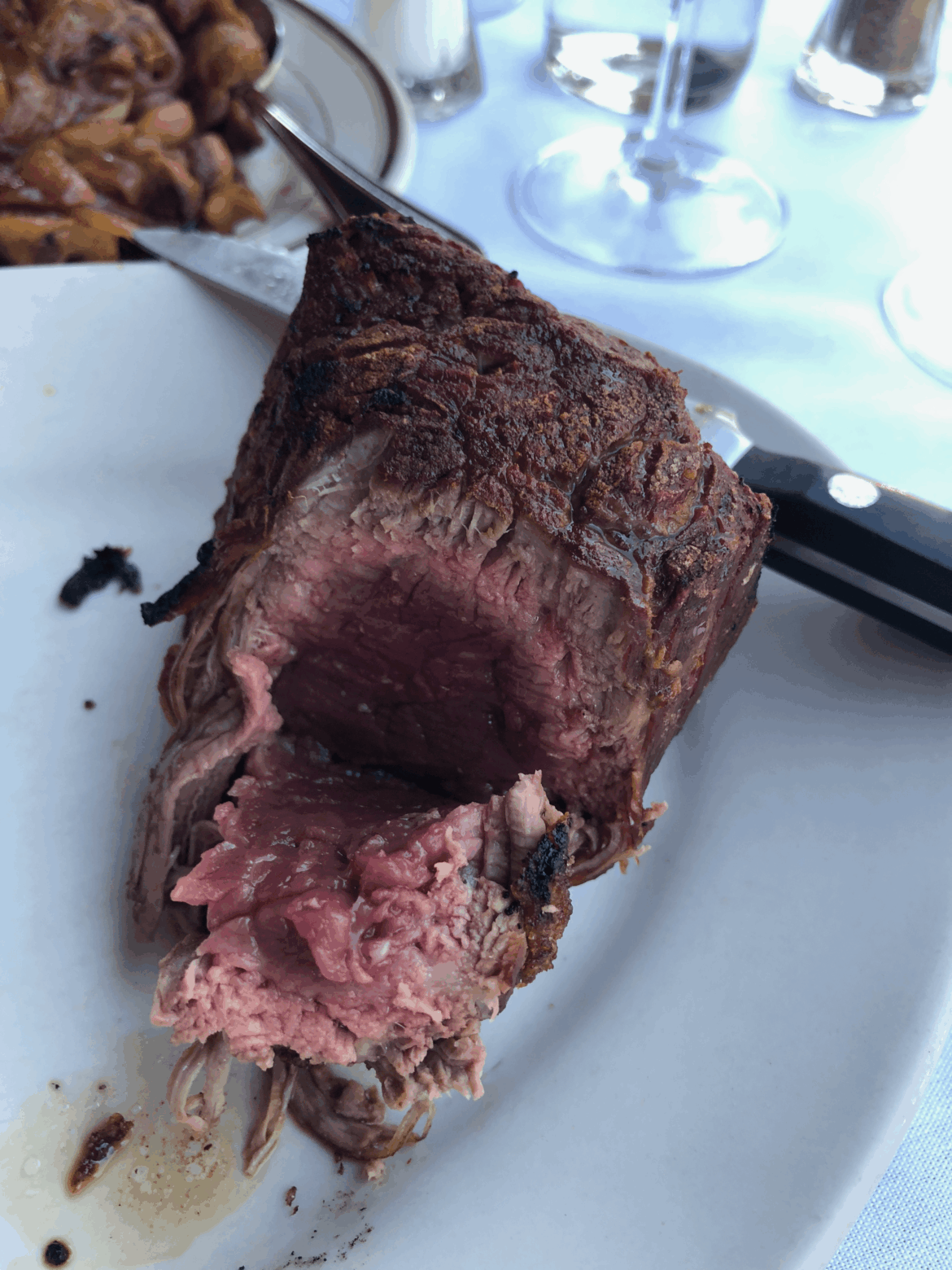 Asked for my steak rare/medium-rare, and this is what came out. I complained, and the manager came over and said "I didn't know how a properly prepared steak is cooked".