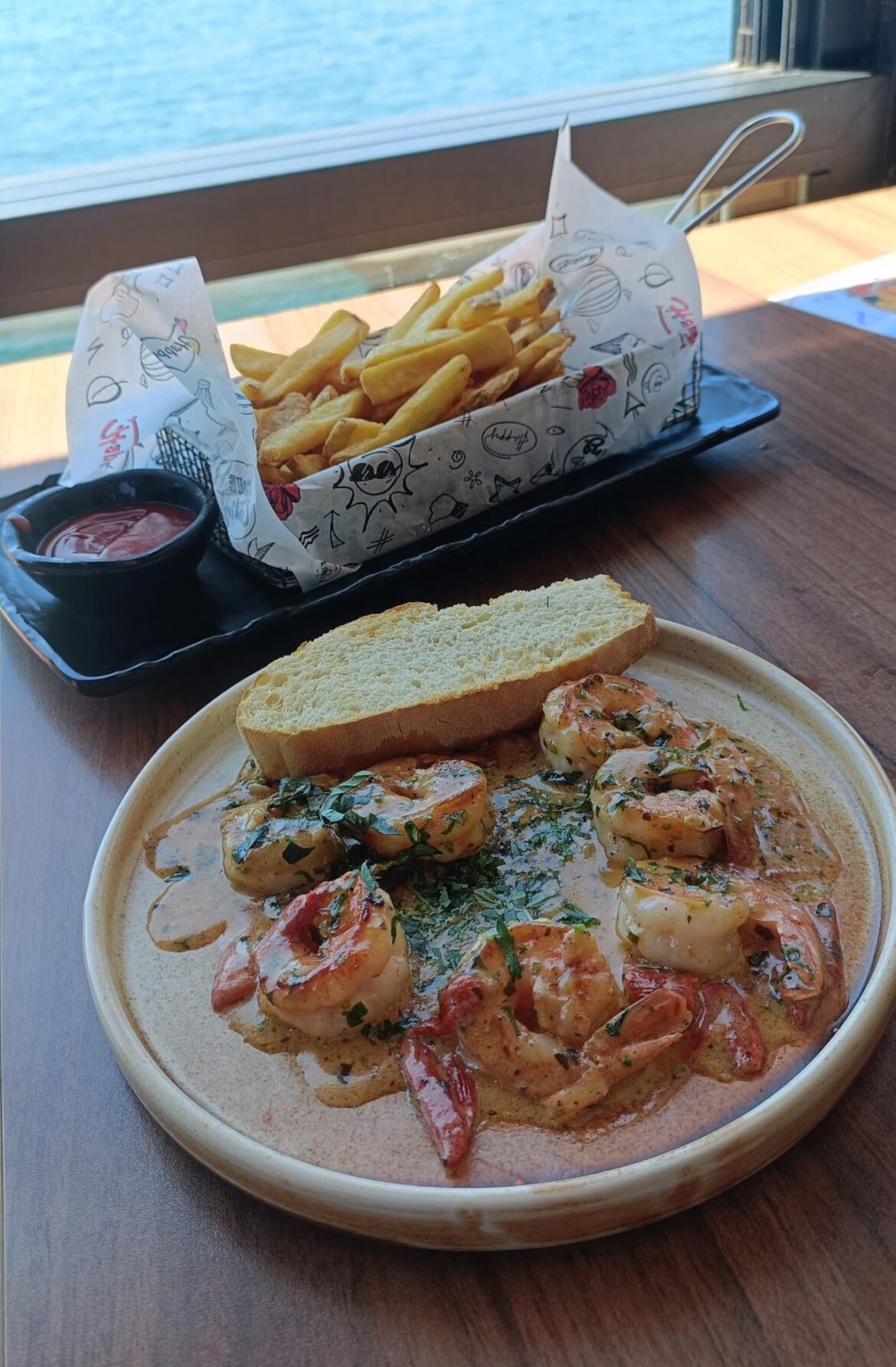Creamy Garlic Shrimp with fries and a sea view!