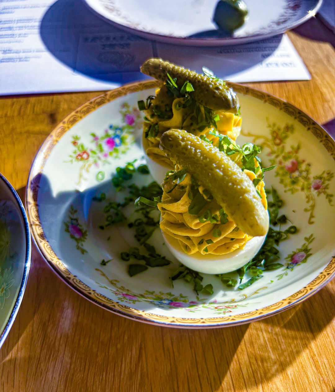 Tall deviled eggs topped with cornichons at Bar Nouveau.