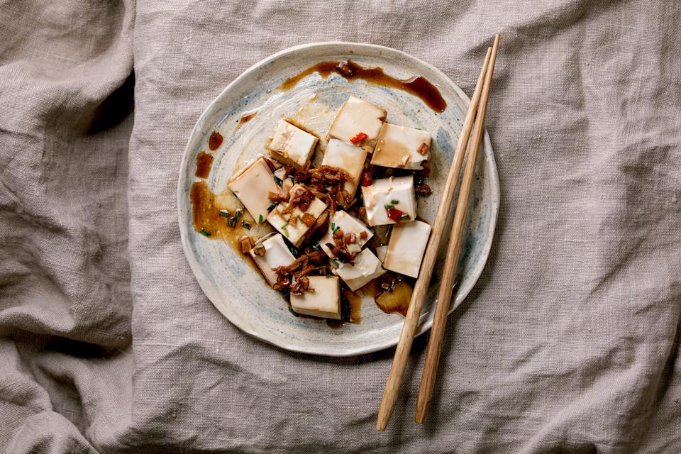 Tofu on a plate with chopsticks