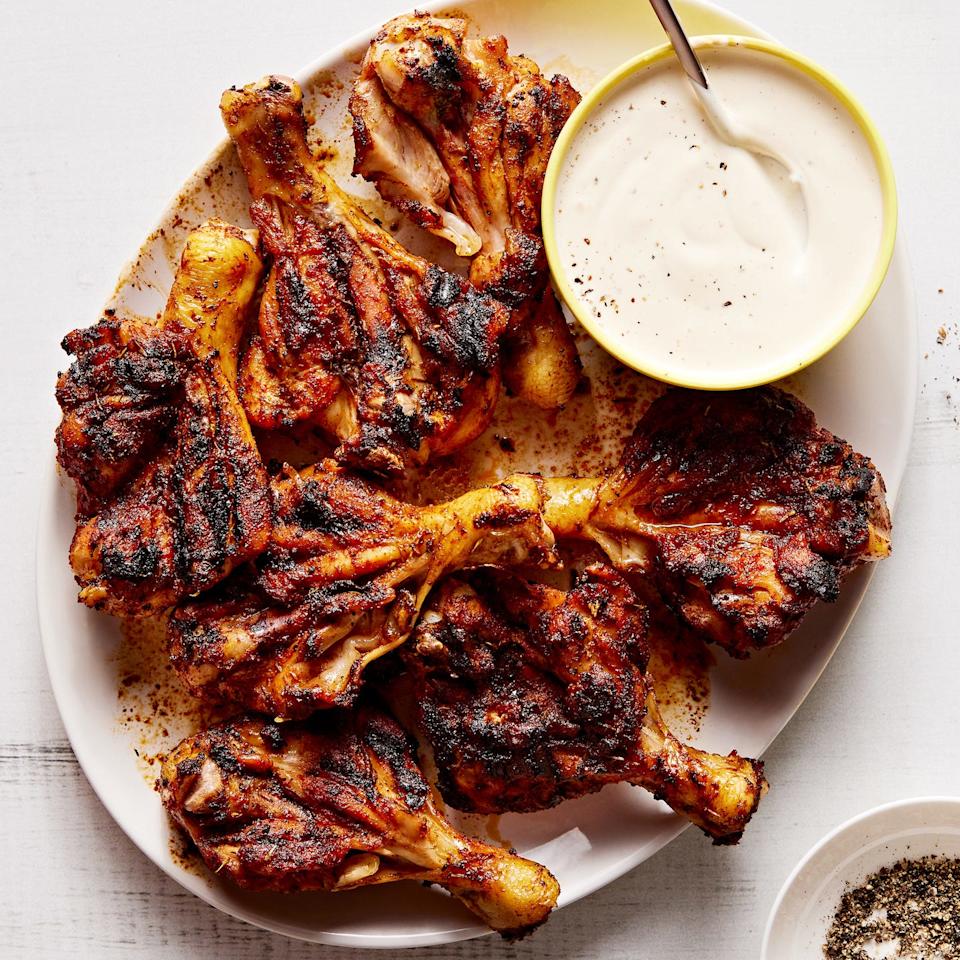 butterflied chicken drumsticks seasoned with brown sugar, smoked paprika, chili powder, garlic powder, and dried thyme and grilled until tender and charred then served with alabama white sauce