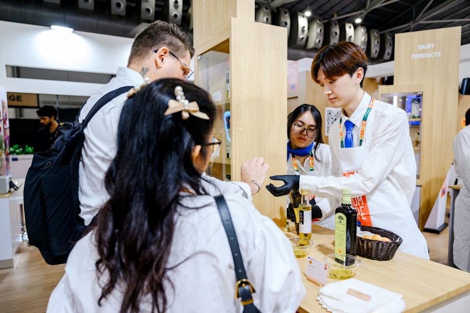 EU FHA - Guests trying food at FHA EU Pavilion