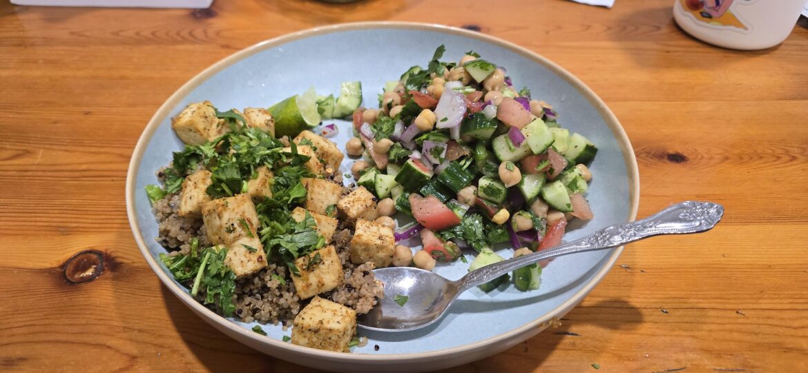 Air fried tofu over quinoa and a tomato, red onion, garbanzo bean, and cucumber salad. 😀