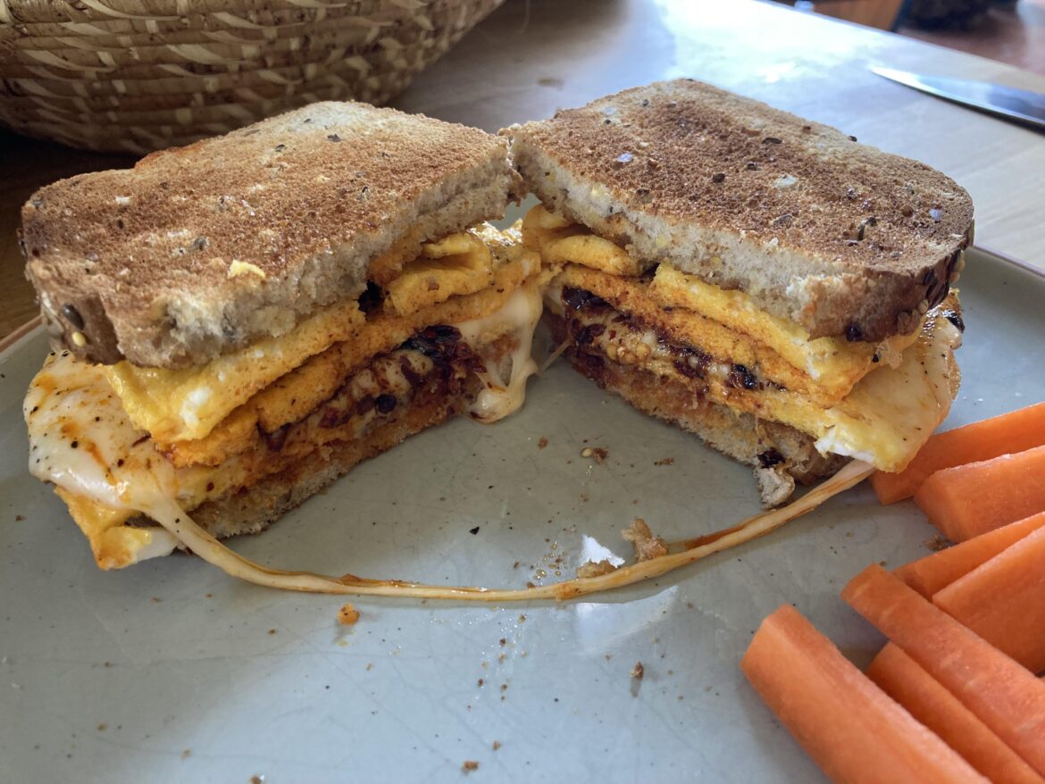 Egg sammie with Muenster and chili crisp.