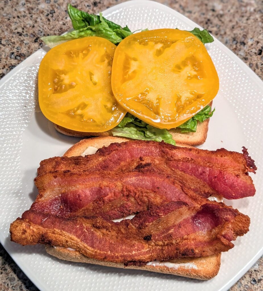 Today's BLT with Wrights bacon and yellow tomato with a little Dukes <swipe> Would have used all 6 slices but my kids got the hankering from that smell 😆🤬