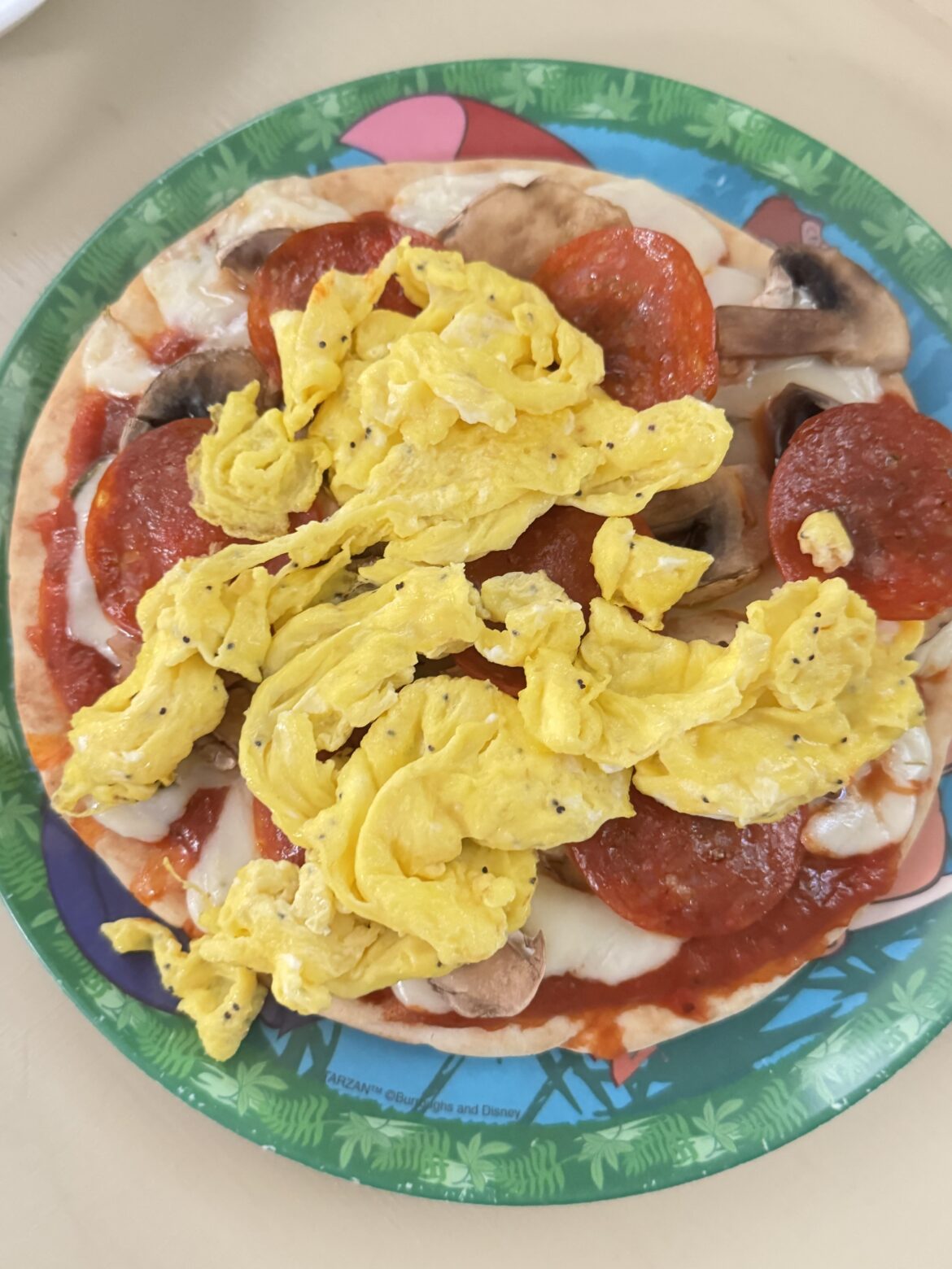 Scrambled on pita pizza
