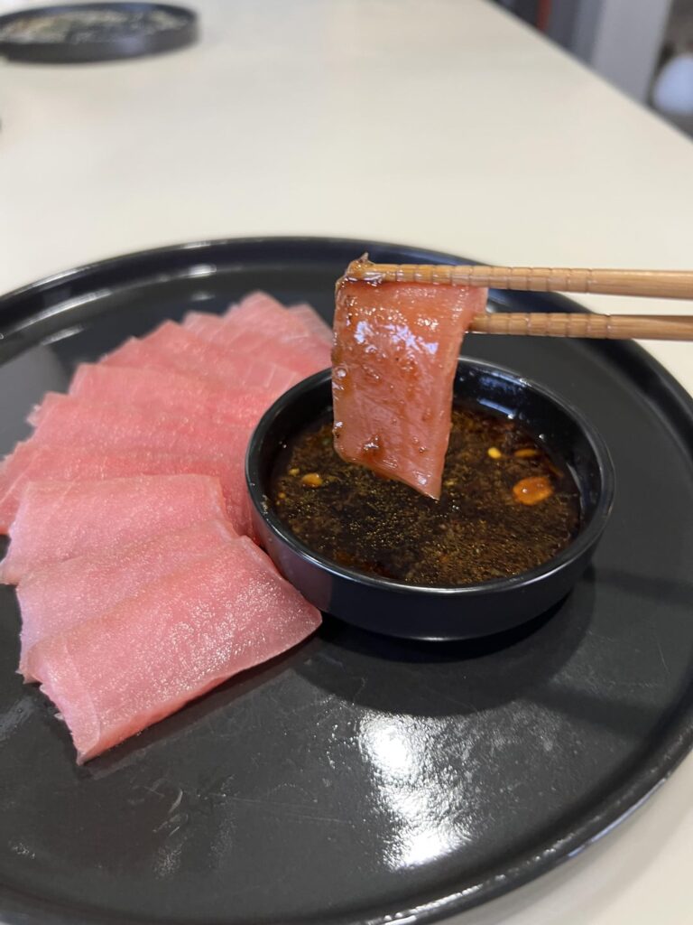 Yellowfin cured in salt, sugar, and dill.  Tamari, ponzu, soy, salsa macha with grated garlic and ginger.