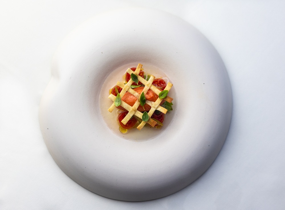 A tomato-based dish with xynomizithra cheese, green olives and basil at the Aleria restaurant, recommended by The MICHELIN Guide. © Aleria