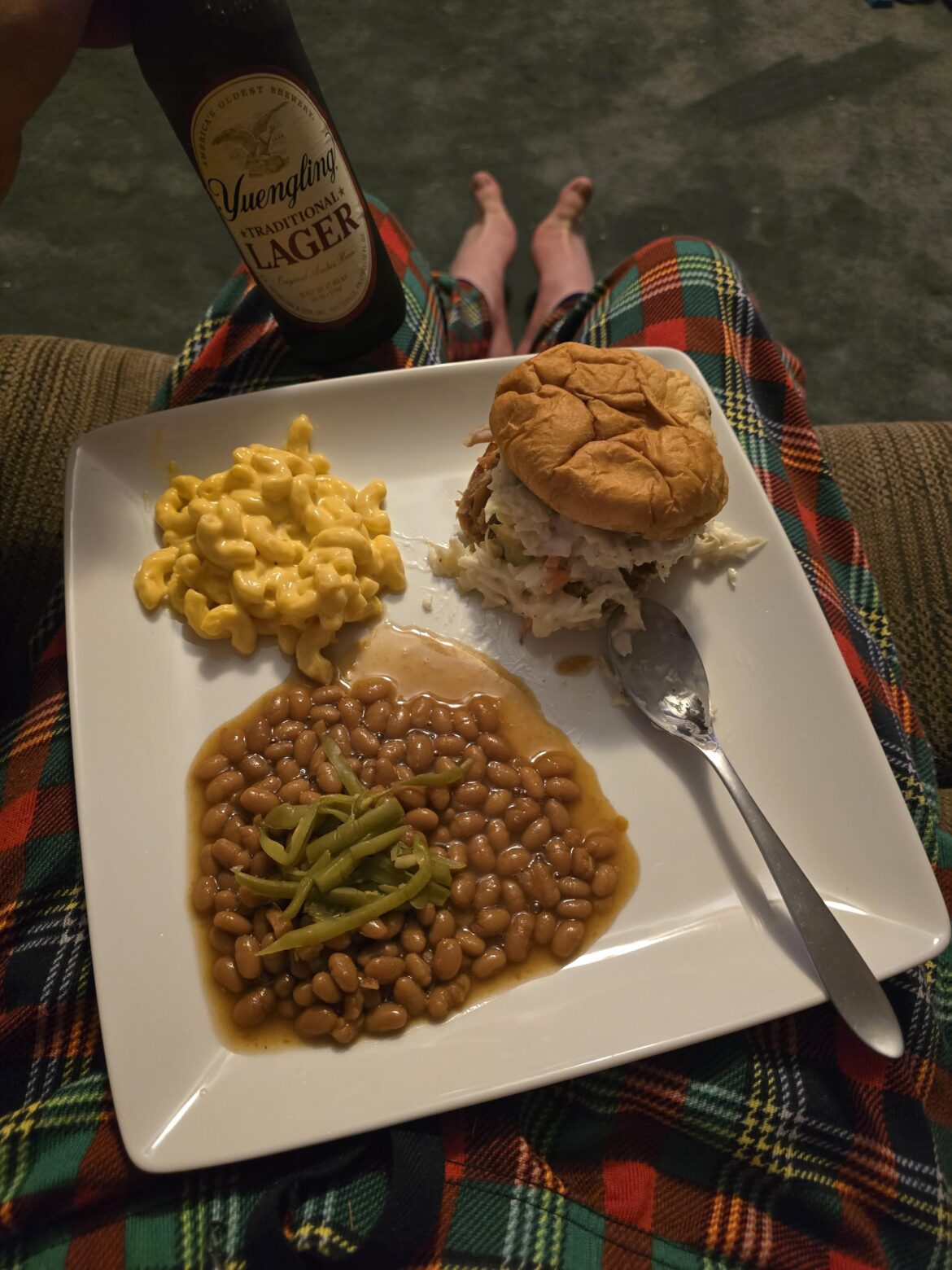 Pork sandwich with slaw, beans, and mac and cheese and Yuengling