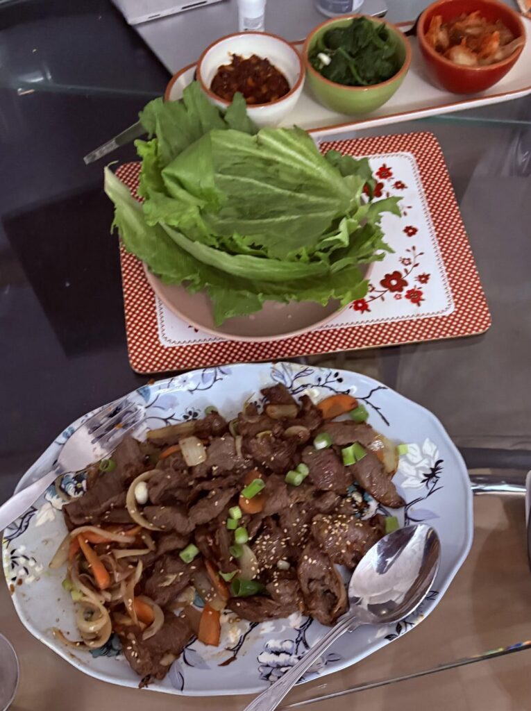Beef Bulgogi with lettuce, Ssjamjang, spinach and Kimchi