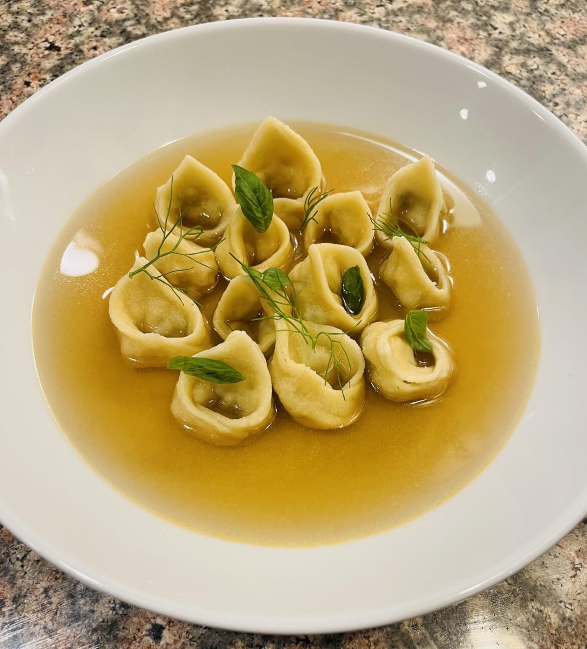 Tortellini stuffed with shrimp in seafood brodo