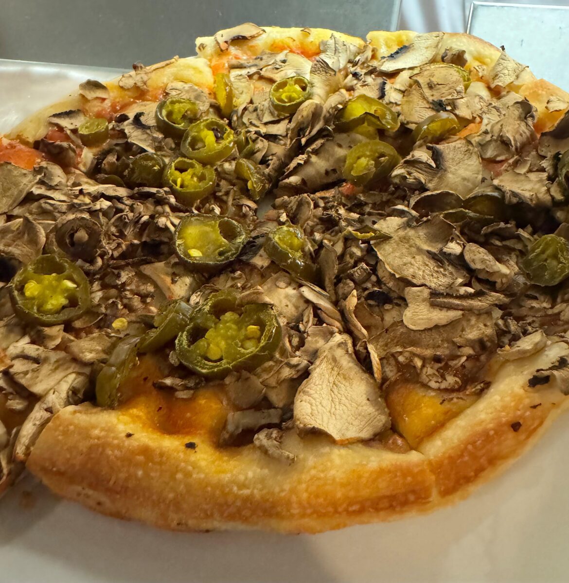 No cheese, sub hot sauce for pizza sauce, double mushroom and jalepeno