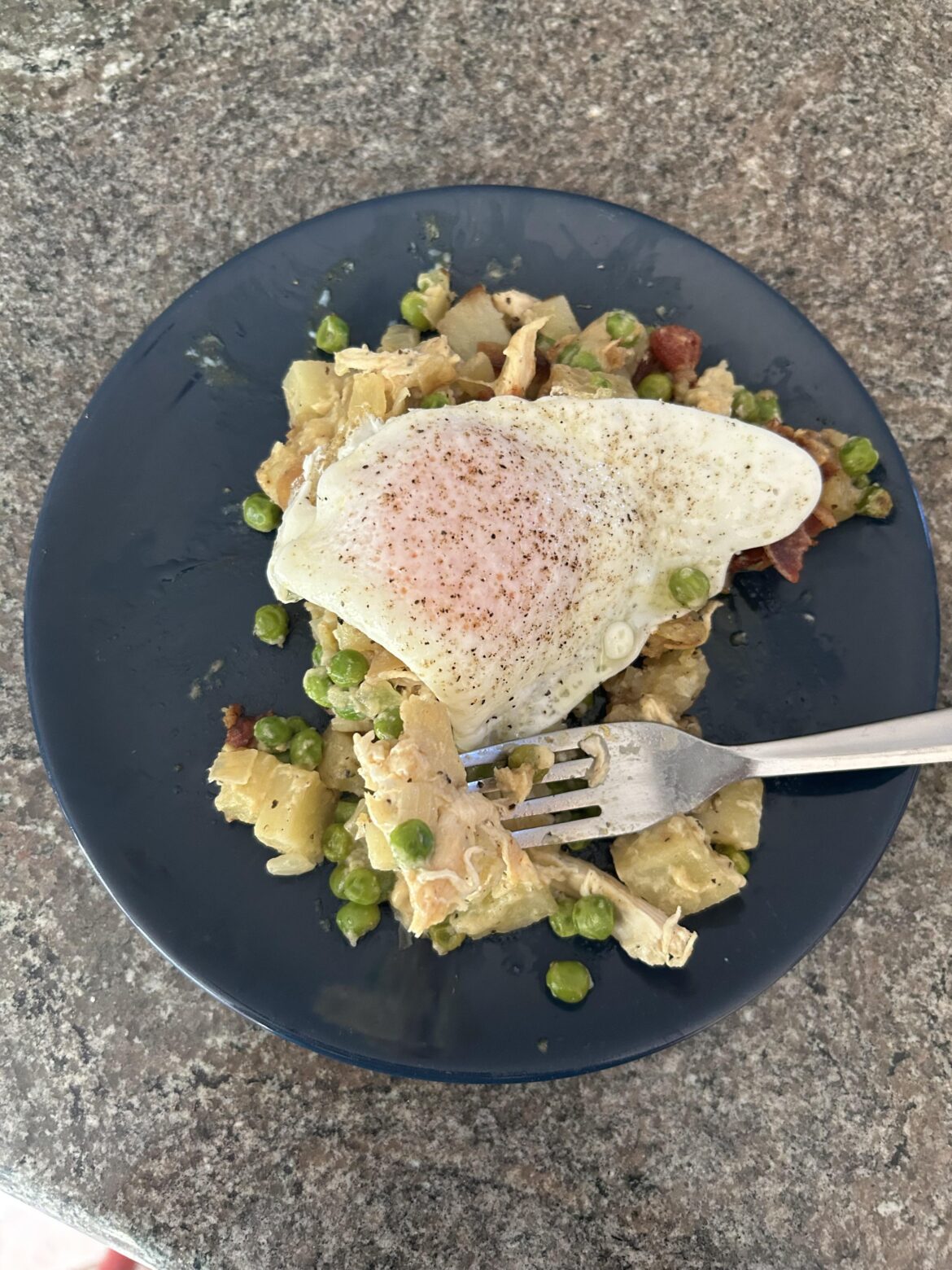 Creamy potato, chicken and bacon casserole with an over easy