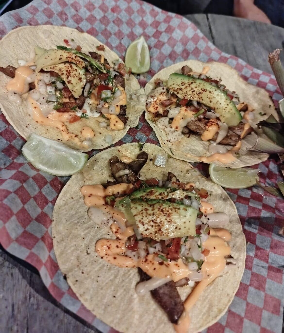 Tacos with sautéed meat, pico de gallo, salsa, avocado and lime to your liking.