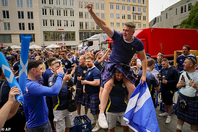 Scotland fans have a party at the Marienplatz square in Munich today before tonight's match
