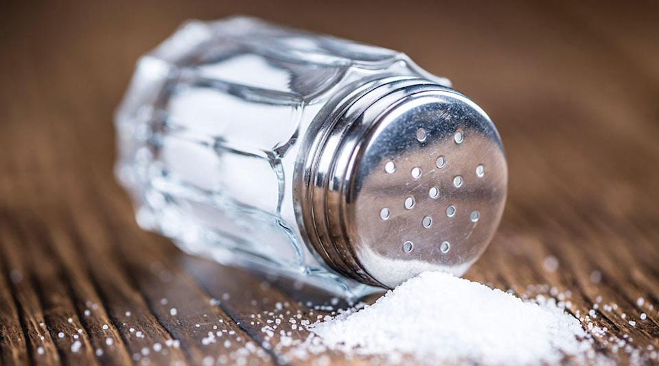 salt shaker spilled on table