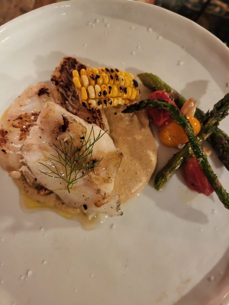 Confit of Alaskan Cod, Cherry Tomatoes and Garlic with Roasted Asparagus and Corn Potato Cream