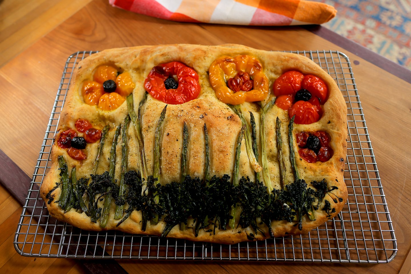At her home in New Hampshire, Esposito baked this focaccia bread with broccoli rabe, spring onions and cherry tomatoes.  