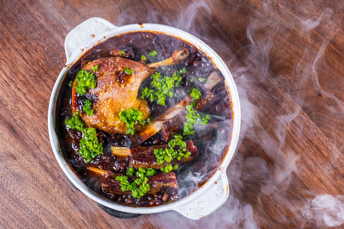 Duck confit with steam rising from the plate at Bistro Lagniappe in Healdsburg, California.