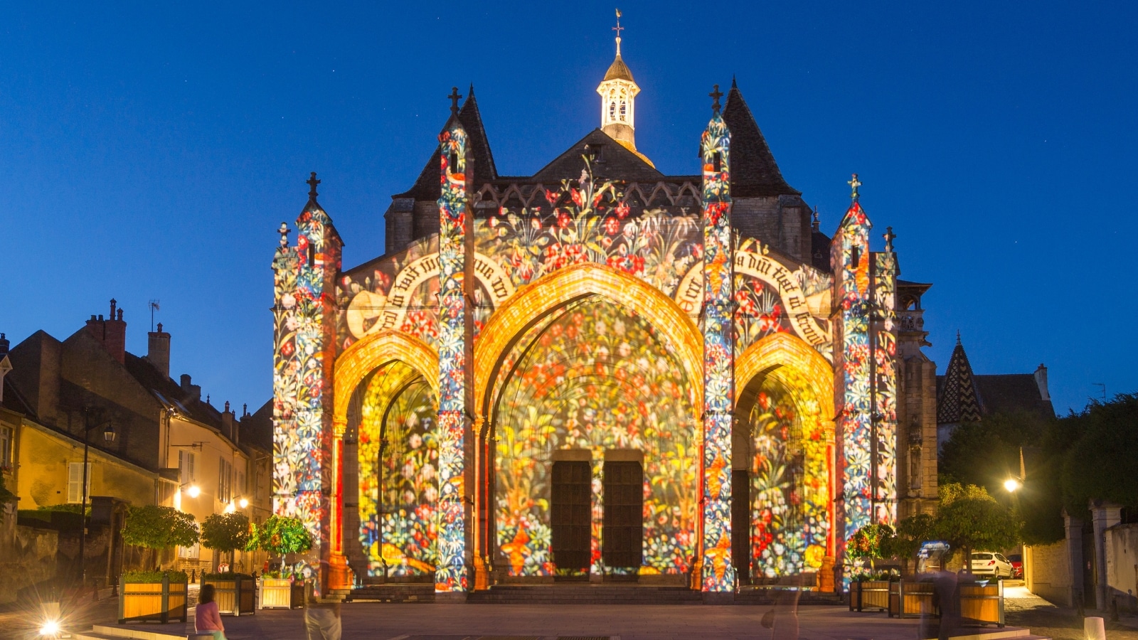 A visual depiction of Chemins de Lumieres in Beaune, France. The image features the illuminated pathways of the installation, likely showcasing the interplay of light and shadows. 