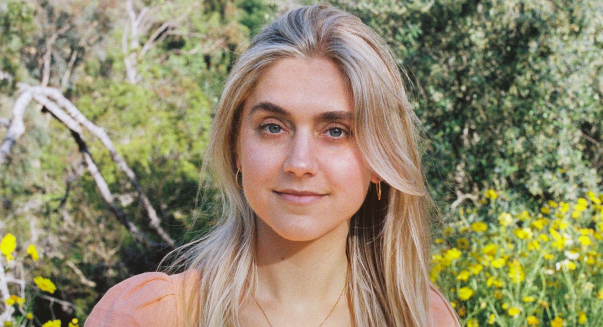Claire Dinhut with greenery in background