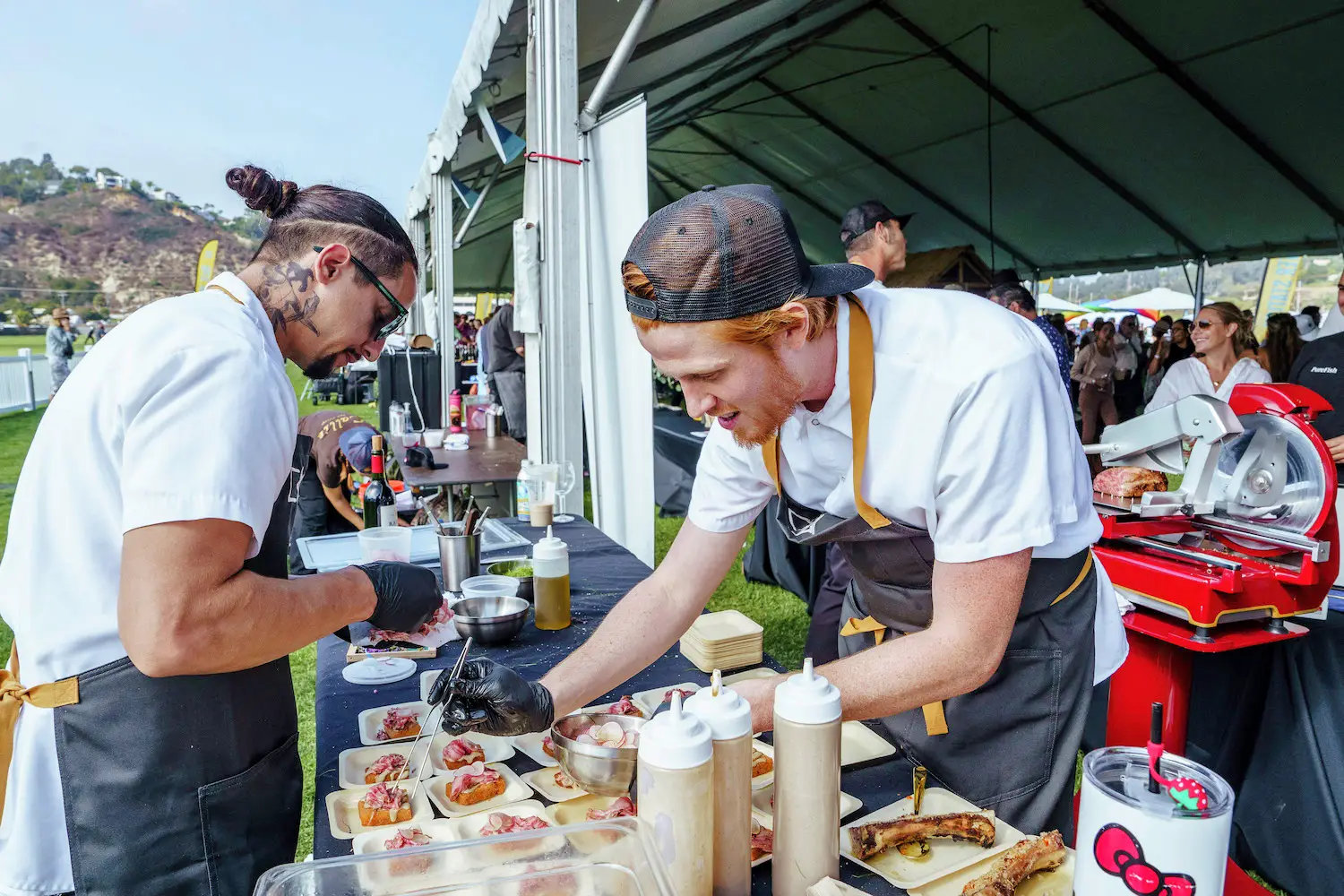 Chefs from San Diego restaurants preparing food for the 2025 Del Mar Wine + Food Festival event