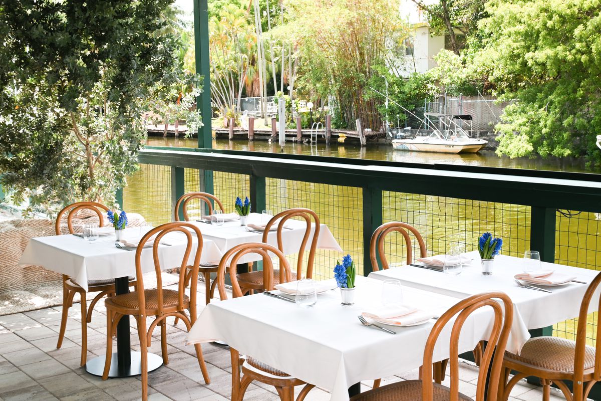 An outdoor Italian terracotta terrace with views of Little River. 