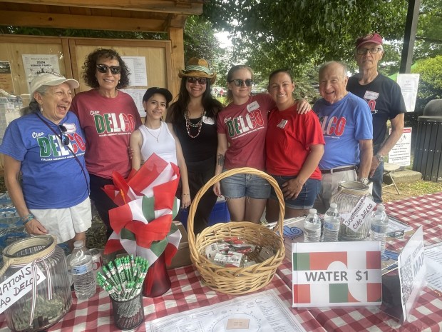 The welcoming committee at last year's Italian American Heritage Festival's information table included, from left, Marguerite Miller, MaryEllen Durning, Adriana Patton, Rose Patton, Lauren Abercrombie, Marie DiMattia, Dr. Jack Colombo, and Charles Miller. Festival attendees can expect another warm welcome to the festival on Sunday, June 1 at Rose Tree Park. (PEG DEGRASSA/ DAILY TIMES)