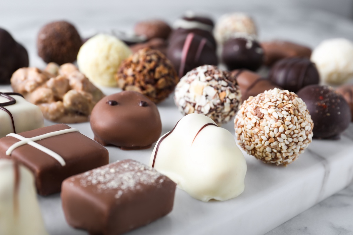 Assortment of fancy chocolates on marble counter