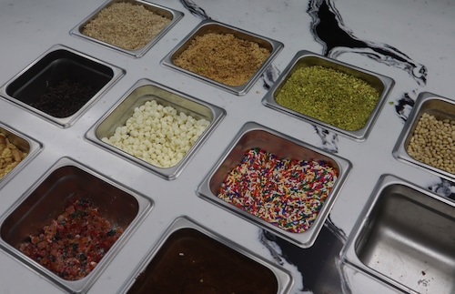 Variety of toppings at The Cannoli Shop in Fairfield, NJ