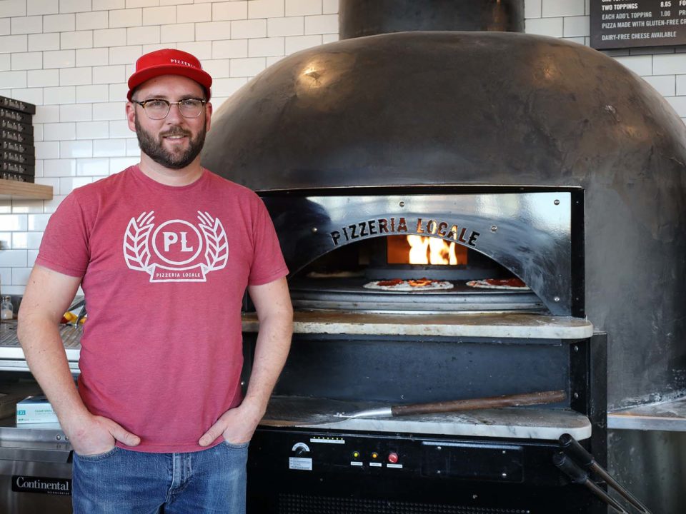 Jordan Wallace in front of his oven at Pizzeria Locale.
