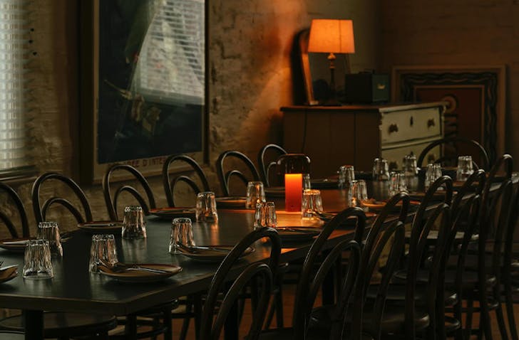 A warmly lit and charming dining room at one of the best Carlton restaurants Kaprica