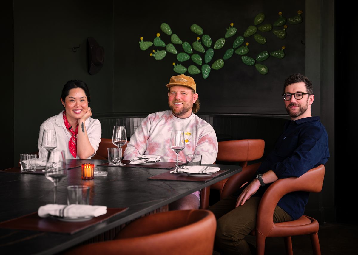 Claudia Lee, Casey Wall, and Richard Hargreave sit in the dining area of Le Calamar.