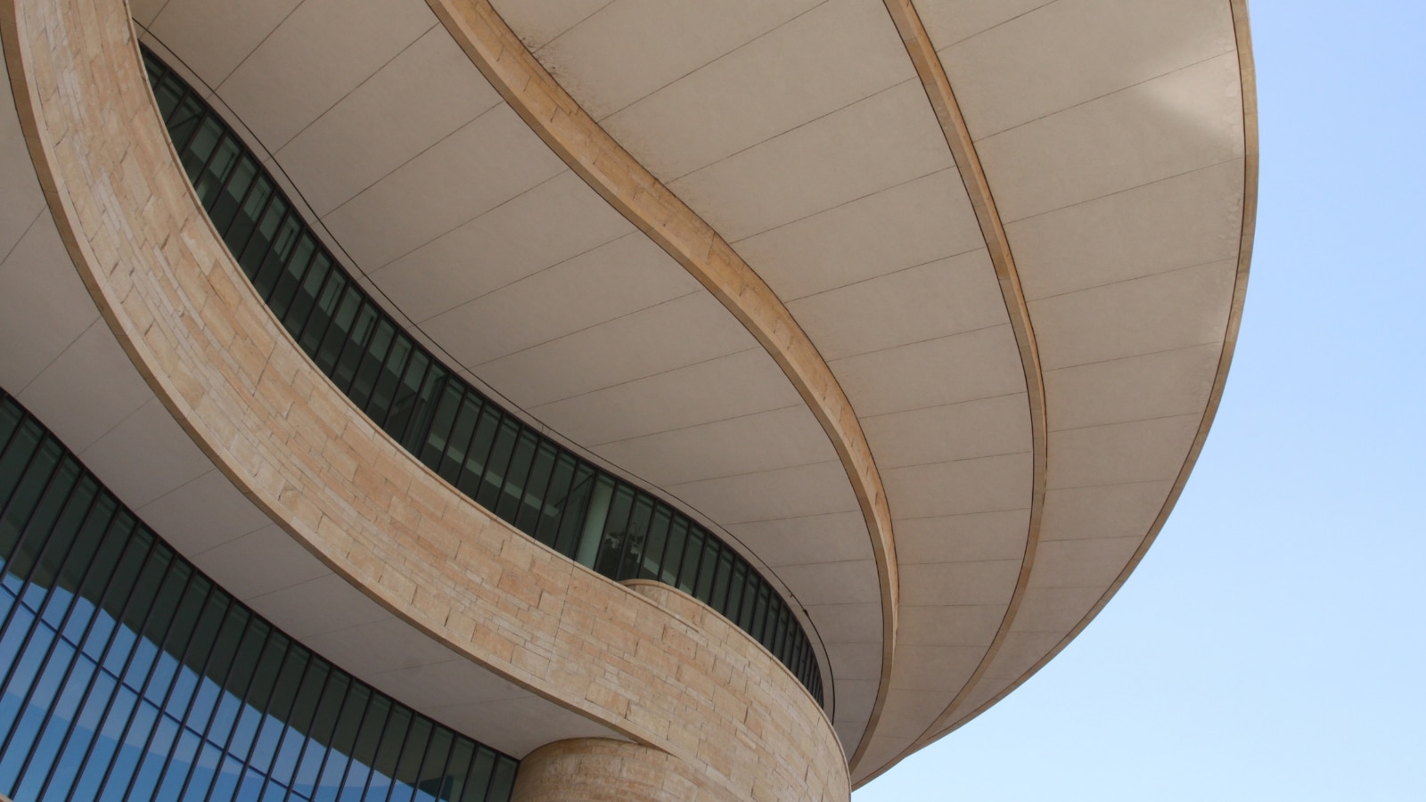 A close-up photograph showcasing the roof of the Maison des Climats building. The image provides detailed insight into the architectural features of the roof, revealing its design and construction elements. The roof exhibits a specific style consistent with the overall aesthetics of the building. 
